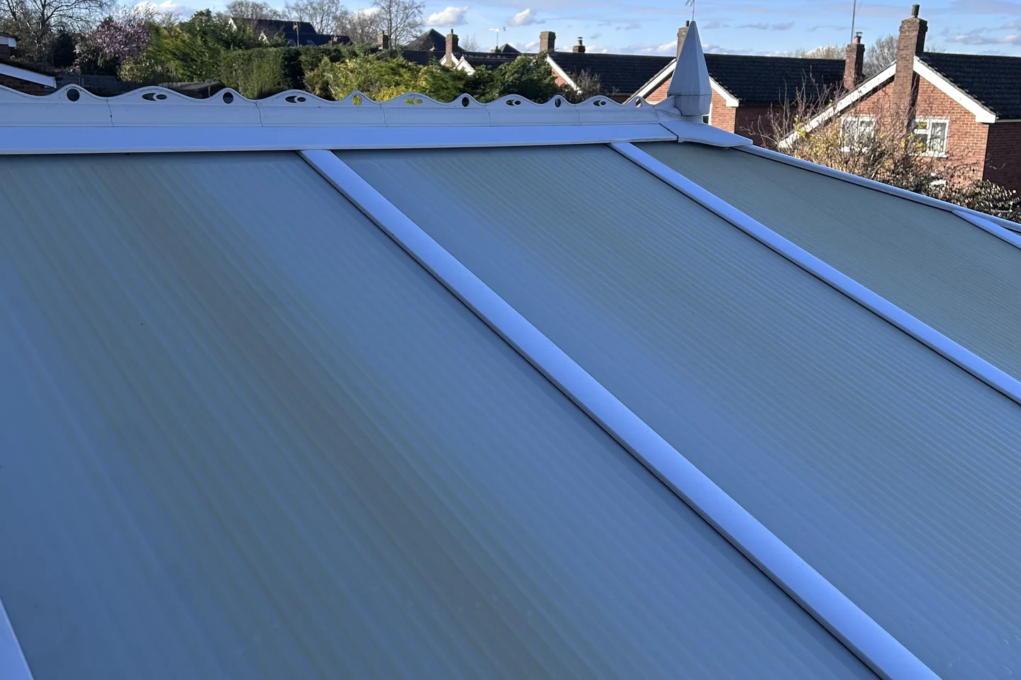 A glazed roof panel cleaned, photographed against a clear sky
