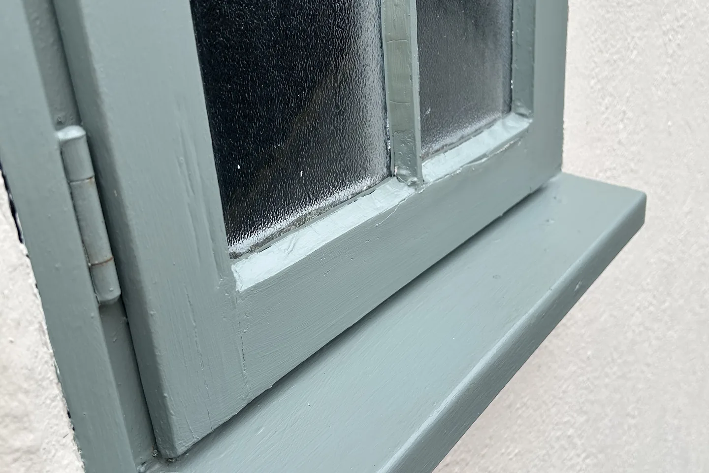 The same timber window frame and sill after cleaning
